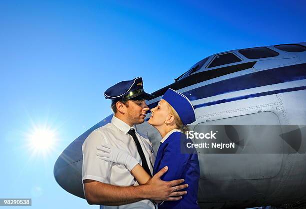 Cabin Crew Couple Stock Photo - Download Image Now - Kissing, Pilot, Adult