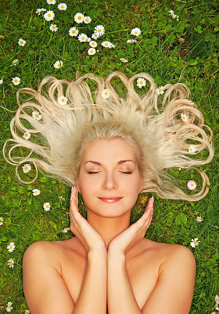 istock Young woman relaxing on a meadow 98290611