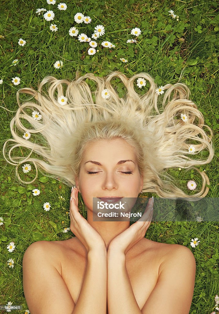 Young woman relaxing on a meadow  Adult Stock Photo