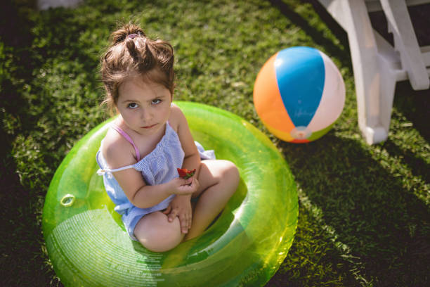istock Child doesn't like eating strawberries 982907396