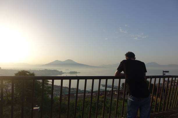 istock Panorama of Naples with man making a selfie 982910632