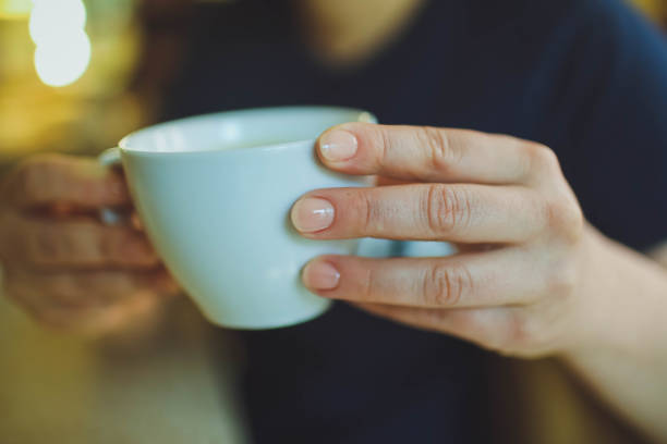 istock Cup of cappuccino on the table, coffee shop background. Marble texture 982913402