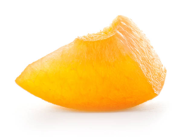 istock slice of apricot isolated on white background 982914236