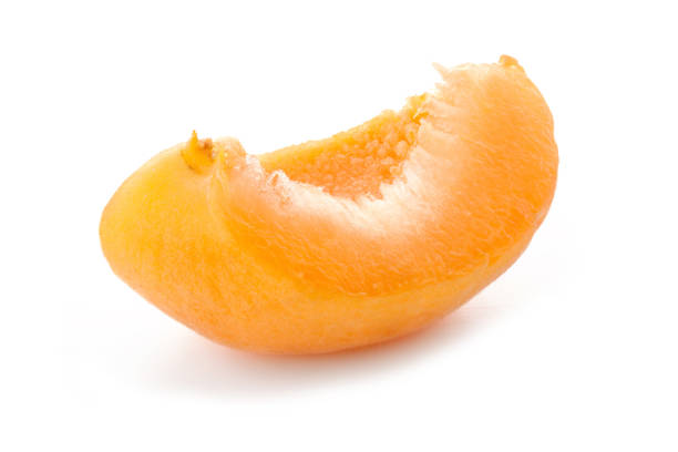 istock Slice of apricot isolated on white background 982914284