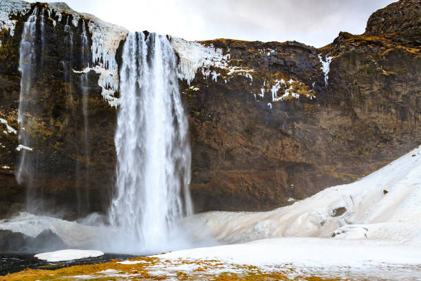 istock Big Seljalandsfoss waterfalls in snowy Winter Iceland 982920820