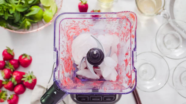 istock Preparing strawberry margarita from fresh organic strawberries. 982922004