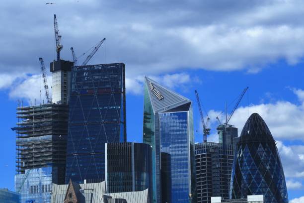 istock London Skyline in a Dark blue sky background 982928904