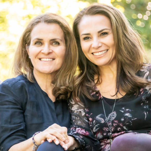 istock Smiling mature female friends posing together 982935582