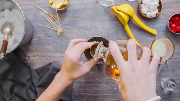 istock Preparing Whiskey sour cocktail at home bar. 982945776