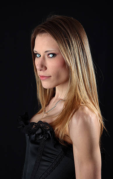 istock Sexy young woman in black basque with dark background 98296627
