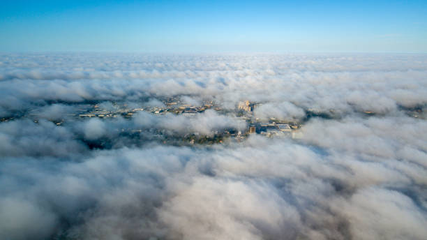 Aerial shot from above the clouds overlooking the city of Miami stock photo