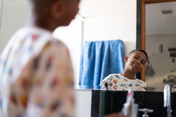 Little Cut Kid Looking to the mirror at morning