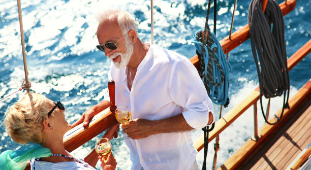 istock Senior couple on a sailing cruise. 982982320