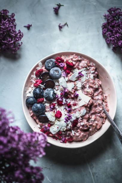 istock Pink oatmeal with berries 982988592