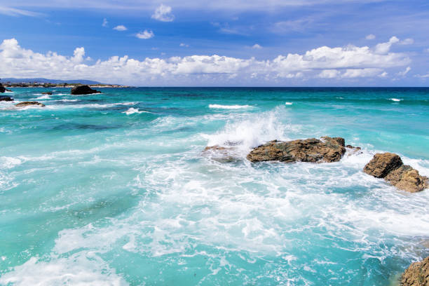 istock Turquoise waves of the ocean and the blue sky with clouds 982989092