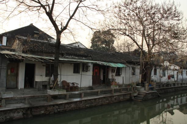 istock Beautiful Chinese city with canal bridge and tree 982989262