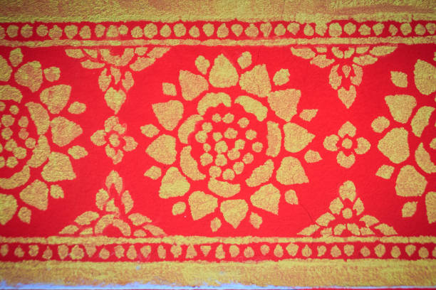 istock Beautiful traditional golden Thai style stucco patterned for decorative on wall background at Buddhist temple in Thailand. 982995922