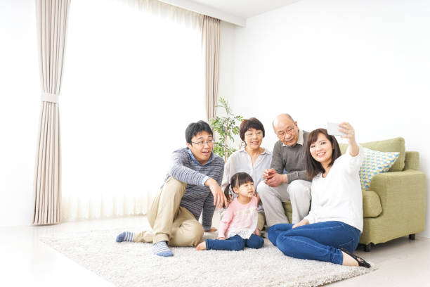 istock Family playing with dog 982999140