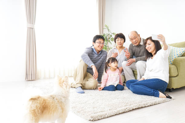 istock Family playing with dog 982999166