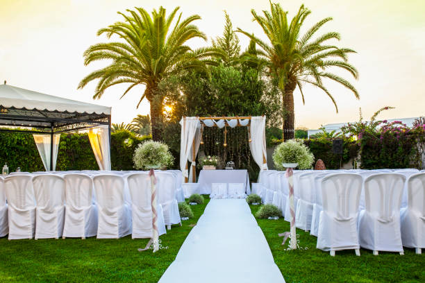 istock White carpet and chairs for an outdoor wedding 983011360