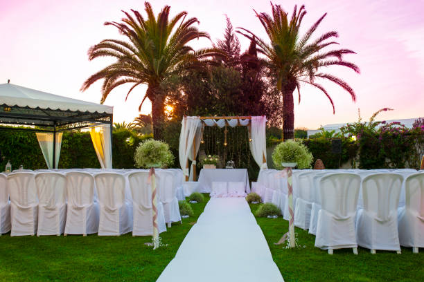 istock White carpet and chairs for an outdoor wedding 983011364