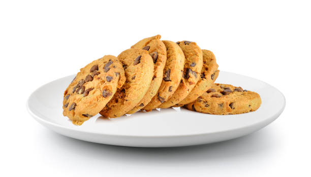 istock Chocolate chip cookie in a plate isolated on a white background 983079286