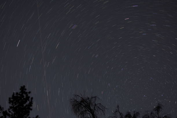 Star trails in the north Long exposure of stars facing north, showing star trails stanislaus national forest stock pictures, royalty-free photos & images