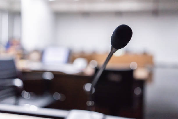 istock Microphone over the blurred business forum Meeting or Conference Training Learning Coaching Room Concept, Blurred background 983098994