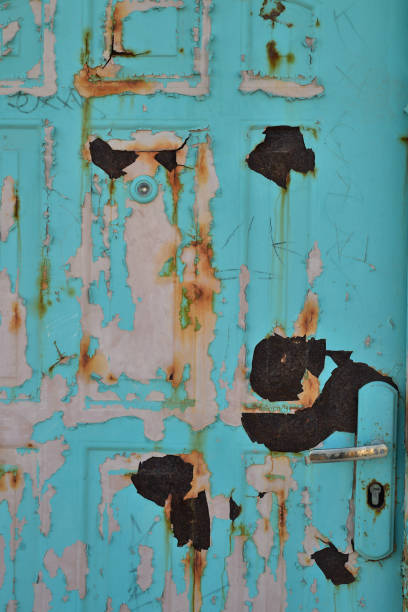 istock abstract background peeling layers pink and blue painted door Baja, Mexico 983106236