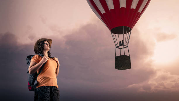 istock Hiker looking toward a hot air balloon 983112166