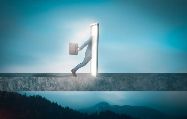 istock Businessman goes through a door portal. 983112480