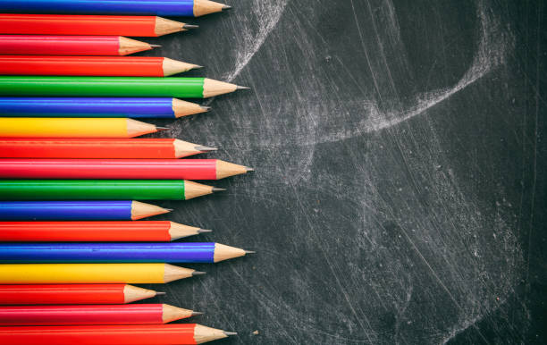 istock Wooden pencils on blackboard 983112510