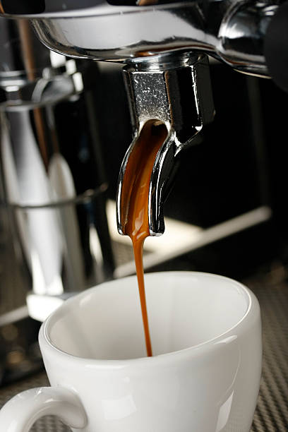 coffee machine brewing cup of coffee, isolated on white background