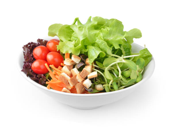 istock salad in plate isolated on white background 983123910