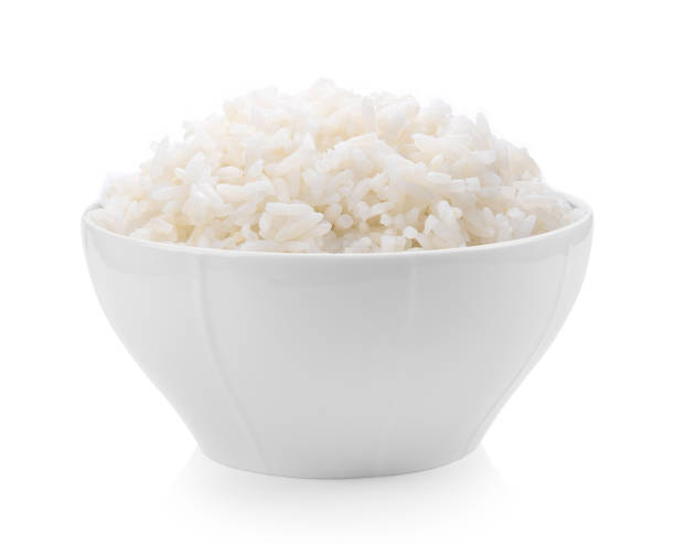 istock rice in white bowl on white background 983127266