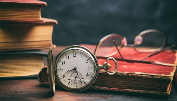istock Vintage books and pocket watch 983127838