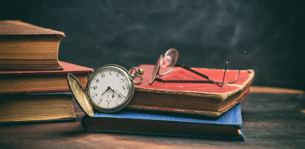 istock Vintage books and pocket watch 983127852