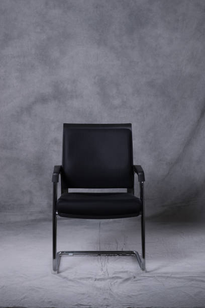 istock A chair in front of a tie dye pattern abstract background 983138070