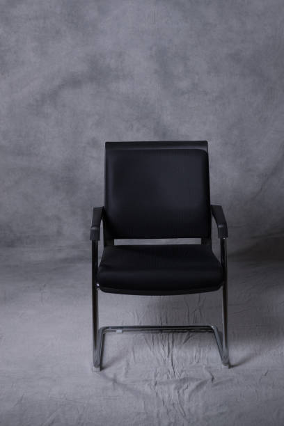 istock A chair in front of a tie dye pattern abstract background 983138138