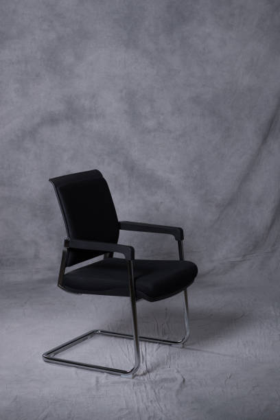 istock A chair in front of a tie dye pattern abstract background 983138284