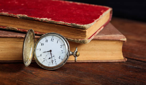 istock Vintage books and pocket watch 983138354