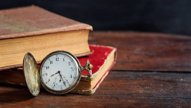istock Vintage books and pocket watch 983138414