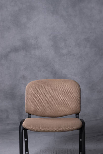 istock A chair in front of a tie dye pattern abstract background 983138904