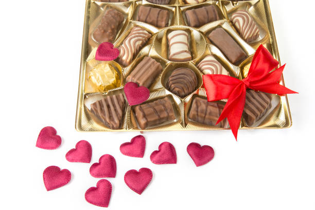 istock Delicious chocolate pralines on the white. Sweet candy 983146734