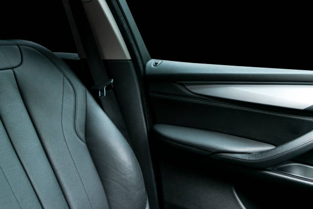 istock Car inside. Interior of a car. Comfortable leather Black seats. Black perforated leather. Car interior details. Car detailing 983166752