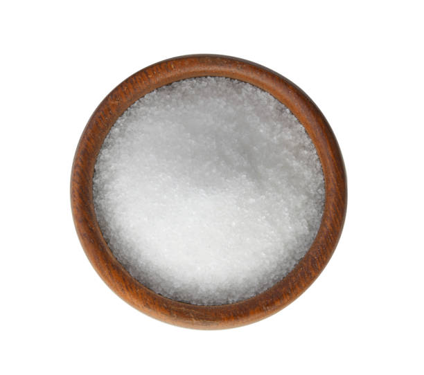 istock sugar in wood bowl on white background 983196314