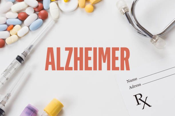 istock ALZHEIMER written on white background with medication 983199354