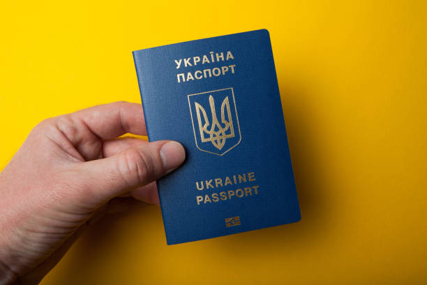 istock Biometric Ukrainian passport in hand 983211106