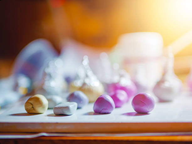 Few buds of polymer clay on the table for handmade craft in the home workplace