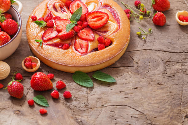 istock cake with strawberry on wooden background 983214584